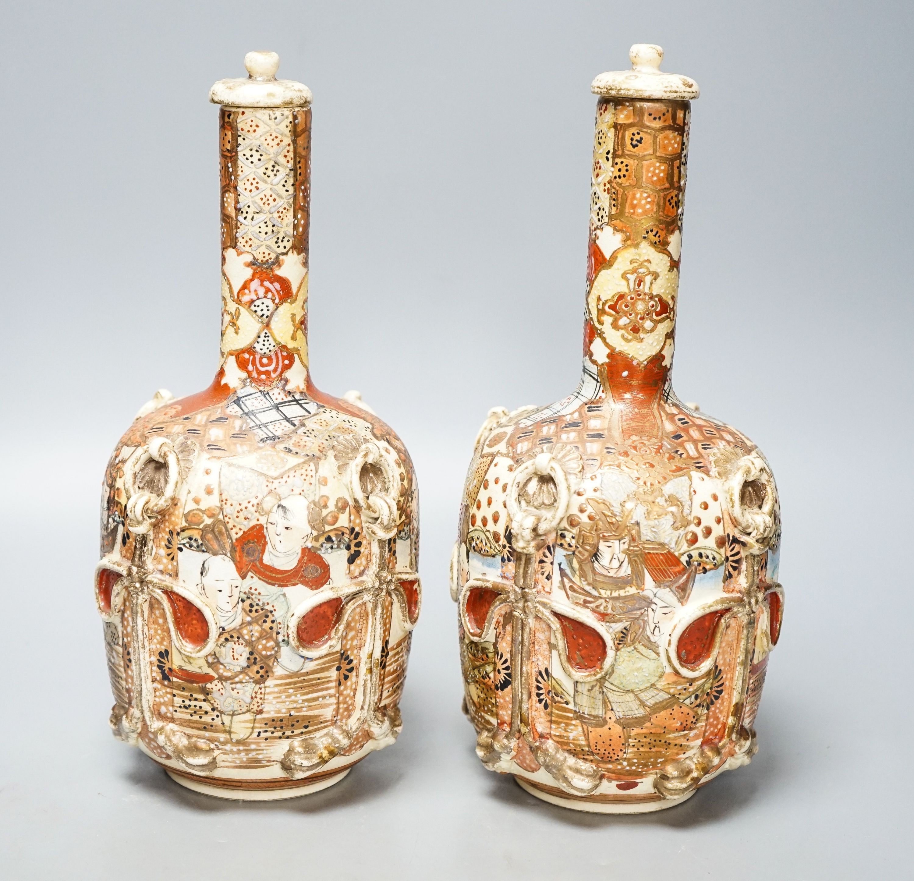 A pair of Japanese Satsuma pottery lidded bottle vases 27cm